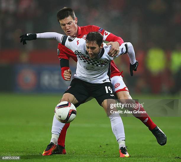 Gaëtan Bussmann of Mainz challenges Filip Ozobic of Qabala during the UEFA Europa League match between 1. FSV Mainz 05 and Qabala FK at Opel Arena on...