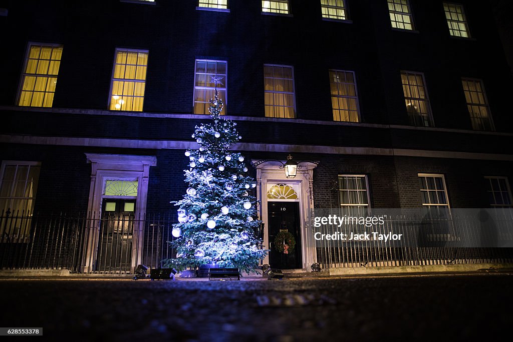 Theresa May Turns On The Downing Street Christmas Lights