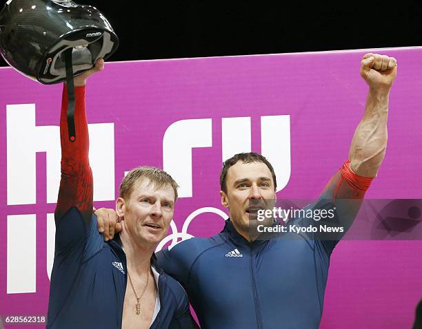 Russia - Alexander Zubkov and Alexey Voevoda of Russia celebrate after winning the gold medal in the men's two-man bobsleigh at the Sochi Winter...