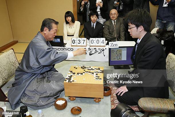 Japan - People's Life Party leader Ichiro Ozawa plays a game of go against the "Zen" computer software in Tokyo on Feb. 16, 2014. Ozawa, one of the...