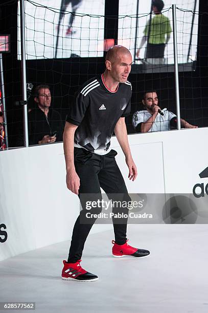 Real Madrid coach Zinedine Zidane presents the new ACE17 Red Limit Boots by Adidas on December 8, 2016 in Madrid, Spain.