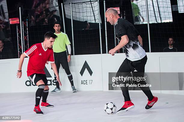 Real Madrid coach Zinedine Zidane presents the new ACE17 Red Limit Boots by Adidas on December 8, 2016 in Madrid, Spain.