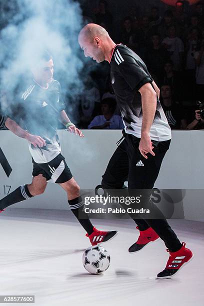 Real Madrid coach Zinedine Zidane presents the new ACE17 Red Limit Boots by Adidas on December 8, 2016 in Madrid, Spain.