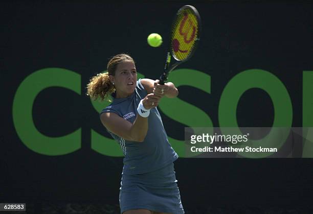 Marta Marrero of Spain returns a shot to Jelena Dokic of Australia during the third round of the Ericsson Open at the Tennis Center at Crandon Park...