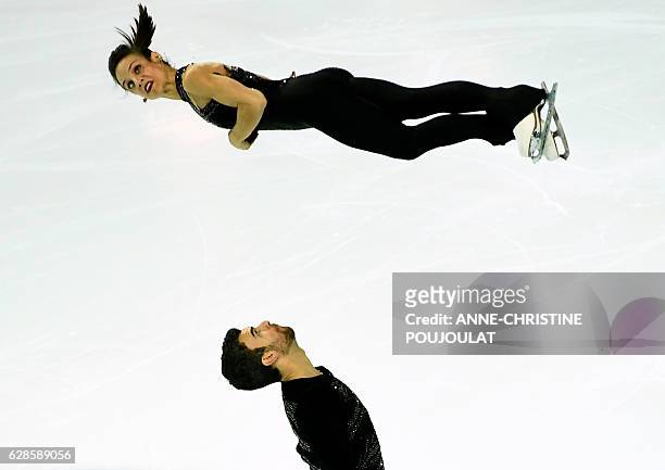 Canada's Meagan Duhamel and Eric Radford compete in the senior pair short program at the ISU Grand Prix of Figure Skating Final, on December 8, 2016...