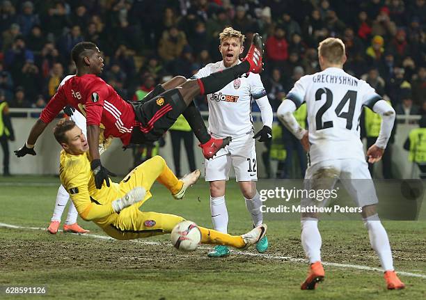 Paul Pogba of Manchester United in action with Ihor Levchenko of FC Zorya Luhansk during the UEFA Europa League match between FC Zorya Luhansk and...