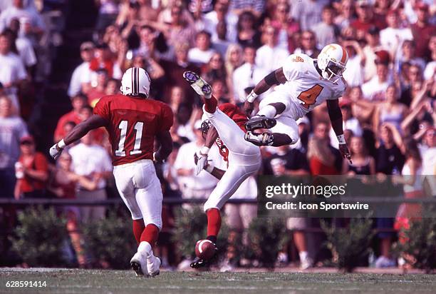 Wide receiver Donte Stallworth of the Tennessee Volunteers and cornerback Andre Goodman South Carolina Gamecocks collide while battling for the ball...