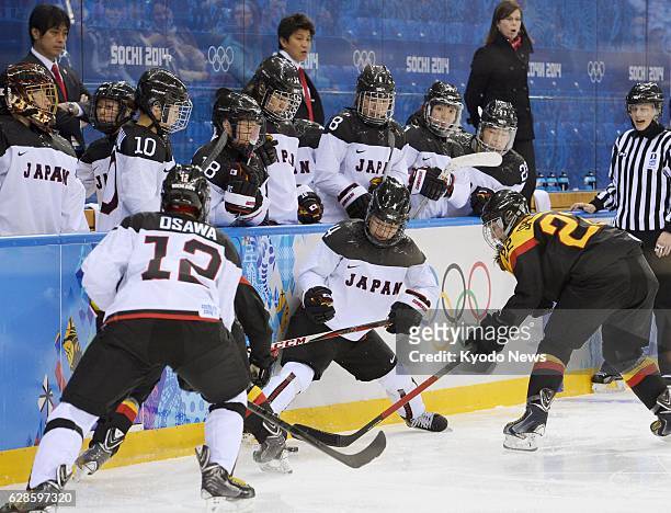 Russia - Japan defender Ayaka Toko keeps the puck during the second period of the women's ice hockey classifications game against Germany at the...