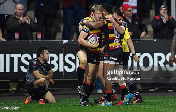 Ollie Thorley of Gloucester celebrates with team mates after scoring the third Gloucester try during the European Rugby Challenge Cup match between...