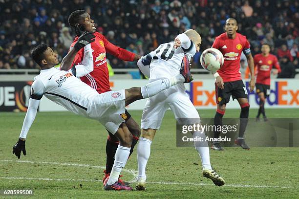 Emmanuel Bonaventure of FC Zorya Luhansk in action against Paul Pogba of Manchester United during the UEFA Europa League group A match between FC...