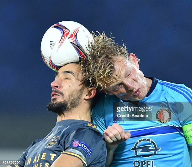 Mehmet Topal of Fenerbahce in action against Dirk Kuyt of Feyenoord during the Europa League group A match between Feyenoord and Fenerbahce at the...