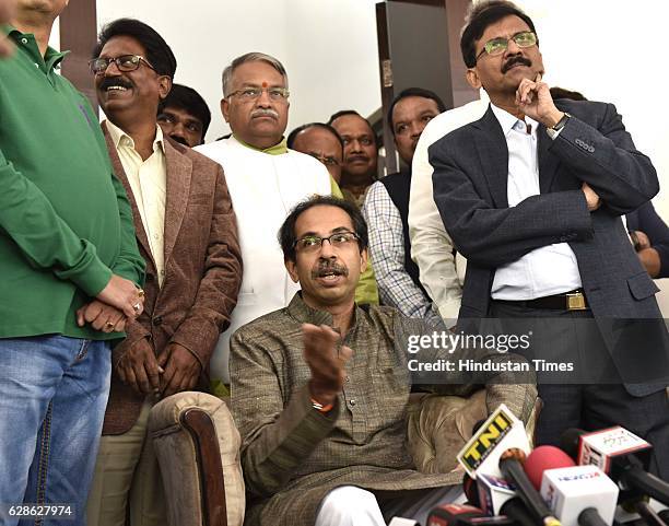 Shiv Sena leader Uddhav Thackeray with his party leaders during his press conference before meeting with Finance Minister on December 8, 2016 in New...