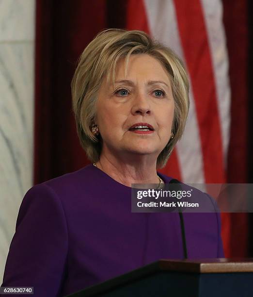 Former US Secretary of State, Hillary Clinton speaks during a portrait unveiling ceremony for outgoing Senate Minority Leader Harry Reid , on Capitol...