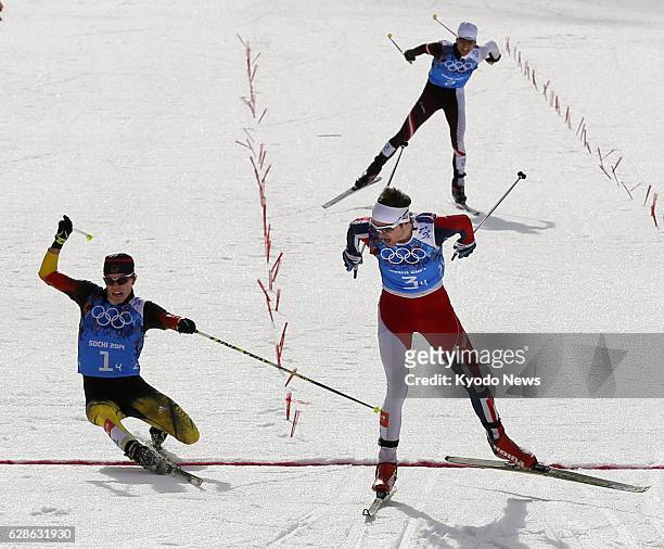 Russia - Joergen Graabak crosses the finish line as Norway win gold in the Winter Olympics Nordic combined team event in Sochi, Russia, on Feb. 20,...
