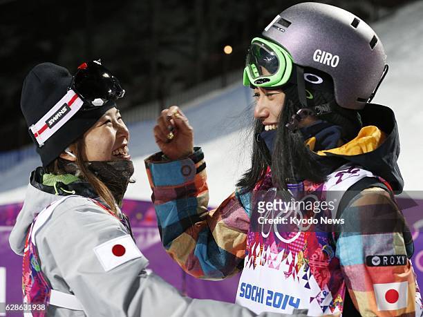 Russia - Ayana Onozuka chats with compatriot Manami Mitsuboshi after their second run in the women's ski halfpipe qualification round at the Rosa...