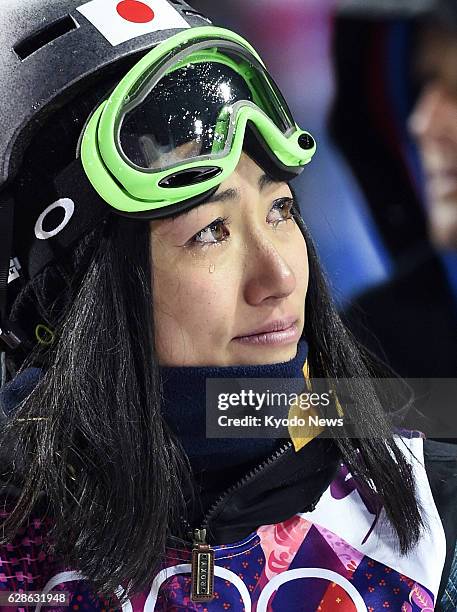 Russia - Manami Mitsuboshi sheds tears after finishing her second run in the women's ski halfpipe qualification round at the Rosa Khutor Extreme Park...