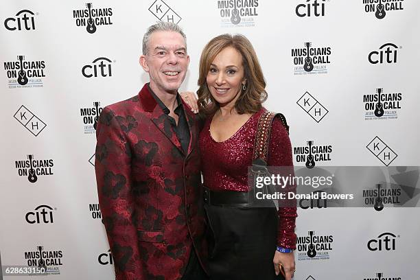 Radio personality Elvis Duran and news anchor Rosanna Scotto attend the Musicians On Call Deck The Halls Holiday Sweater Party at Kola House on...