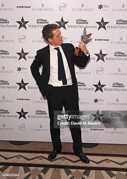 Hugh Grant, winner of the Best Actor award for "Florence Foster Jenkins", poses at The London Evening Standard British Film Awards at Claridge's...