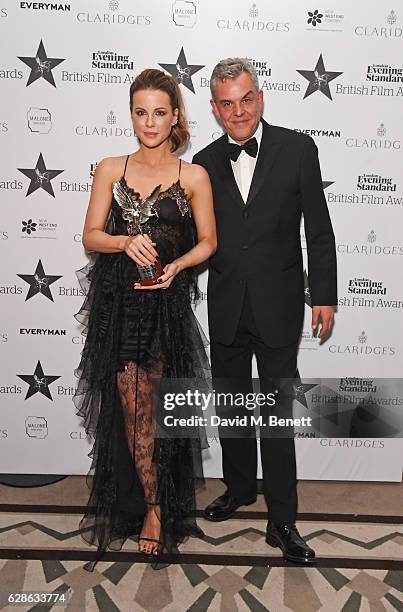 Kate Beckinsale, winner of the Best Actress award for "Love & Friendship", and presenter Danny Huston pose at The London Evening Standard British...