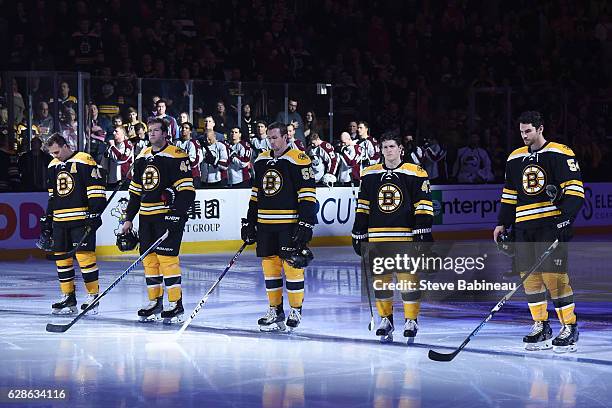 David Krejci, David Backes, Tim Schaller, Torey Krug and Adam McQuaid of the Boston Bruins on the blue line for the strain line up before the game...