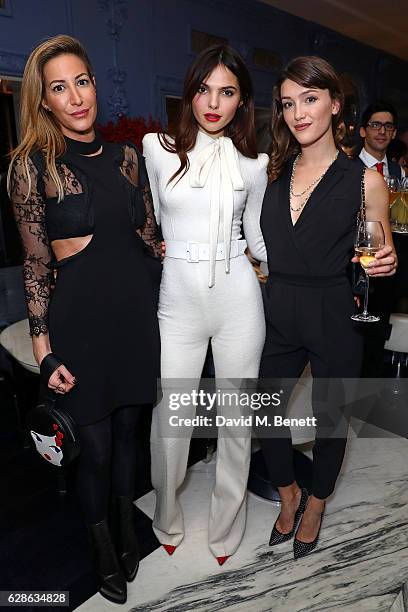 Laura Pradelska, Doina Ciobanu and Eleanor Gecks attend OMEGA Constellation Globemaster dinner at Marcus on December 8, 2016 in London, England.