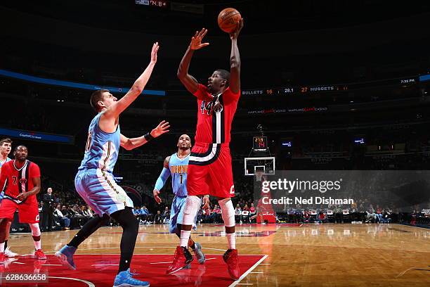 Andrew Nicholson of the Washington Wizards shoots the ball against the Denver Nuggets on December 8, 2016 at Verizon Center in Washington, DC. NOTE...