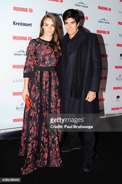 Chloe Gosselin and David Copperfield at MARINA 70 at Solomon R. Guggenheim Museum on December 8, 2016 in New York City.