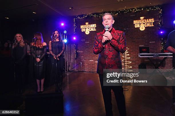 Radio personality Elvis Duran speaks onstage during the Musicians On Call Deck The Halls Holiday Sweater Party at Kola House on December 8, 2016 in...