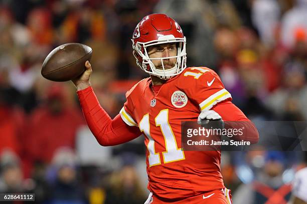 Quarterback Alex Smith of the Kansas City Chiefs throws a pass against the Oakland Raiders at Arrowhead Stadium during the first quarter of the game...