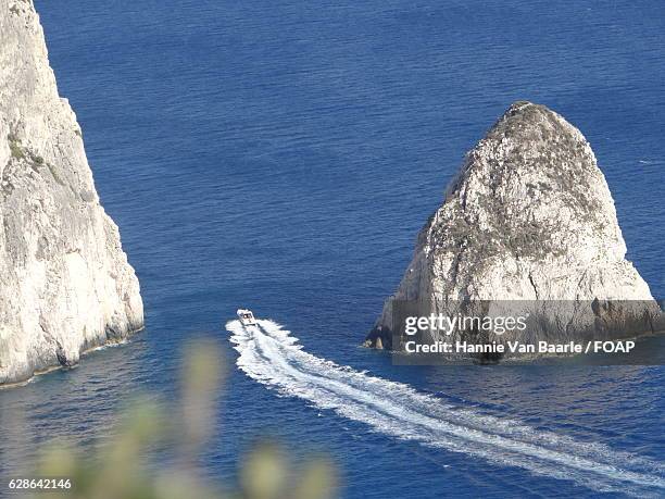 high angle view of speedboat in sea - hannie van baarle stock pictures, royalty-free photos & images