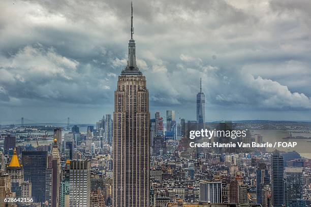 view of empire state building - hannie van baarle stock pictures, royalty-free photos & images