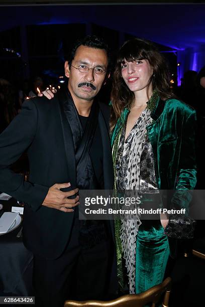 Stylist Haider Ackermann and actress Lou Doillon attend the Annual Charity Dinner hosted by the AEM Association Children of the World for Rwanda at...