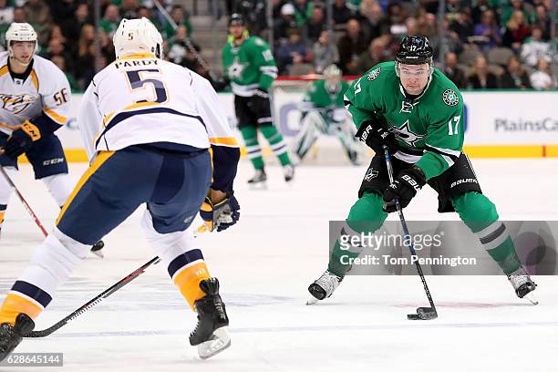 Devin Shore of the Dallas Stars controls the puck against Adam Pardy of the Nashville Predators in the first period at American Airlines Center on...