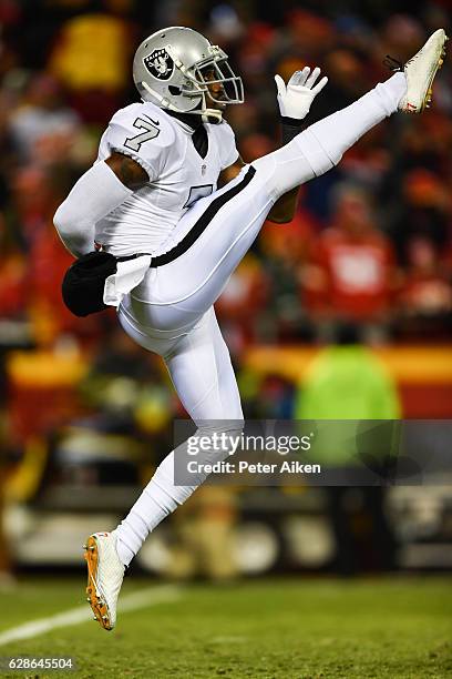 Punter Marquette King of the Oakland Raiders is fully extended after punting the football to the Kansas City Chiefs at Arrowhead Stadium during the...