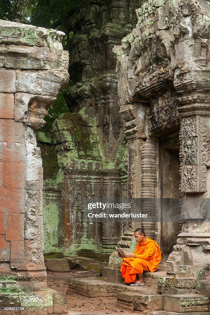 Monk reading at ruins