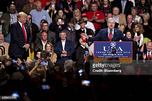 President-elect Donald Trump, left, looks on as Terry Branstad, governor of Iowa and Trump's pick to be the U.S. Ambassador to China, speaks during...