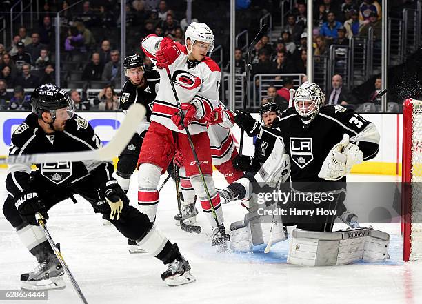 Jeff Zatkoff of the Los Angeles Kings reacts to a shot as Andrej Nestrasil of the Carolina Hurricanes looks for a rebound during the first period at...