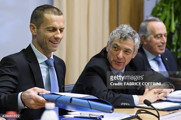 President Aleksander Ceferin smiles next to UEFA first vice-president Angel Maria Villar Llona during the opening of an executive meeting at the...
