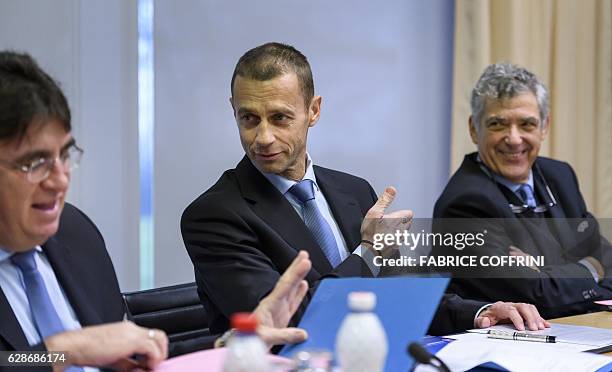President Aleksander Ceferin gestures between UEFA general secretary Theodore Theodoridis and first vice-president Angel Maria Villar Llona during...
