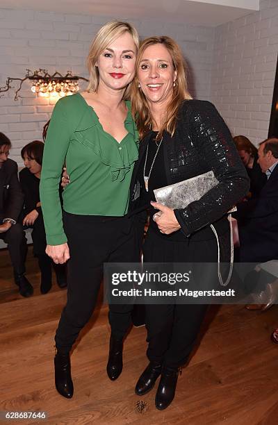 Saskia Valencia and Carin C. Tietze during the CONNECTIONS PR X-MAS Cocktail at Kaefer Atelier on December 8, 2016 in Munich, Germany.