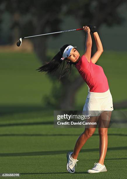 Muni He of China plays her second shot on the 10th hole during the delayed second round of the 2016 Omega Dubai Ladies Masters on the Majlis Course...