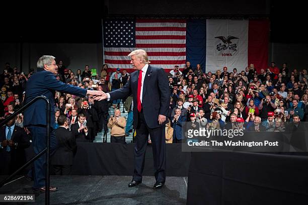 President-Elect Donald J. Trump greets Iowa Gov. Terry Branstad as they speak during a "USA Thank You Tour 2016" event at Hy-Vee Hall in the Iowa...