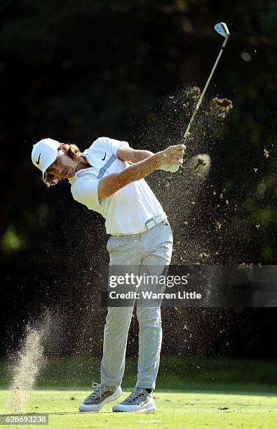 Tommy Fleetwood of England plays his second shot into the 11th green during the second round of the USB Hong Kong Open at The Hong Kong Golf Club on...