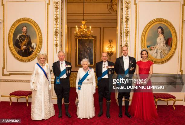 Britain's Queen Elizabeth II stands with her husband Britain's Prince Philip, Duke of Edinburgh , her son Britain's Prince Charles, Prince of Wales...