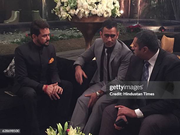 President Anurag Thakur and Indian cricketer MS Dhoni during the wedding reception of Indian Cricketer Yuvraj Singh and Bollywood actor Hazel Keech,...