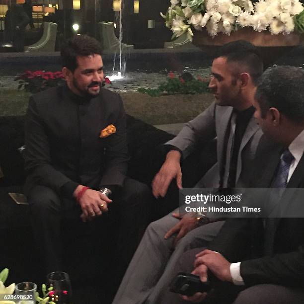 President Anurag Thakur and Indian cricketer MS Dhoni during the wedding reception of Indian Cricketer Yuvraj Singh and Bollywood actor Hazel Keech,...