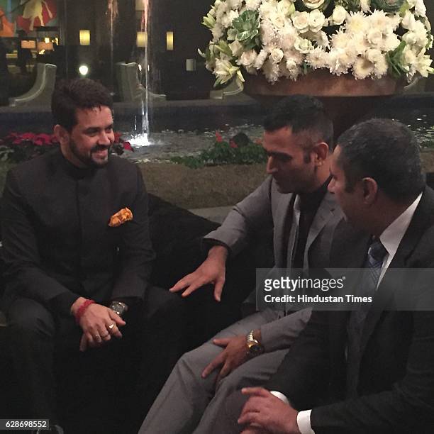 President Anurag Thakur and Indian cricketer MS Dhoni during the wedding reception of Indian Cricketer Yuvraj Singh and Bollywood actor Hazel Keech,...