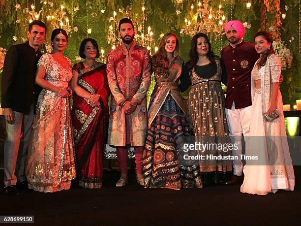 Indian Cricketer Yuvraj Singh with his wife and Bollywood actor Hazel Keech and Cricketer Harbhajan Singh with his wife and actor Geeta Basra during...