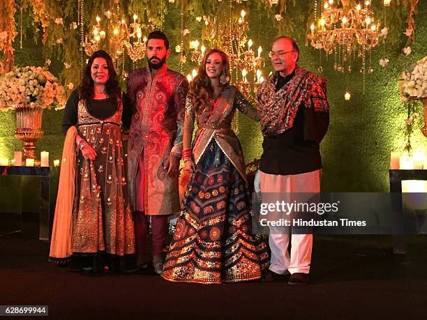 Indian Cricketer Yuvraj Singh with Bollywood actor Hazel Keech and Finance Minister Arun Jaitley during their wedding reception, at ITC Maurya, on...