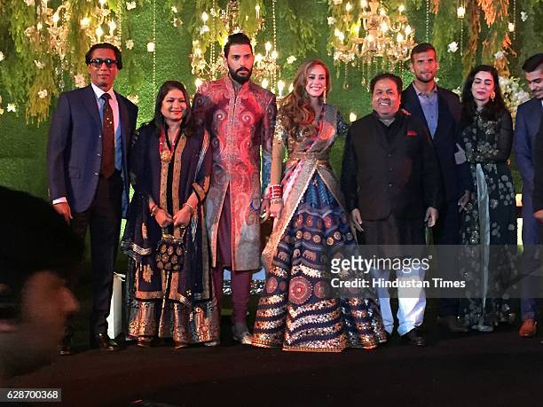 Indian Cricketer Yuvraj Singh with his wife and Bollywood actor Hazel Keech and IPL Chairman Rajiv Shukla with wife Anuradha Prasad during their...